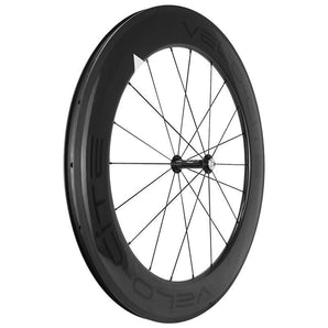 Angled shot of a deep-section carbon front wheel for road bicycles.