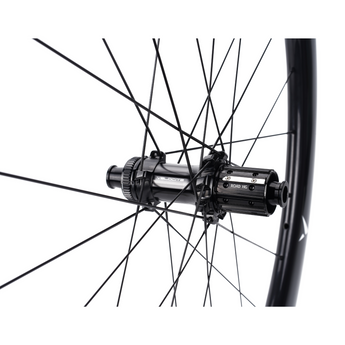 Close-up of Hyperdrive carbon wheel rear hub by Velocite, engineered for durability and smooth performance in cycling.