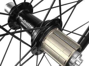 Close-up view of a Velocite freehub mounted on a rear road bike wheel.