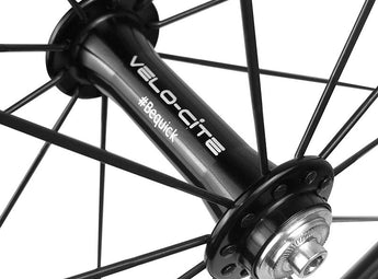 Close-up view of the Velocite front hub on a lightweight carbon wheel.