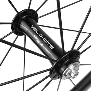 Close-up view of the Velocite front hub on a lightweight carbon wheel.