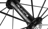 Close-up view of the Velocite front hub on a lightweight carbon wheel.