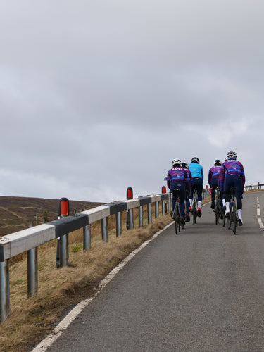 Pro cycling team riding in the mountains